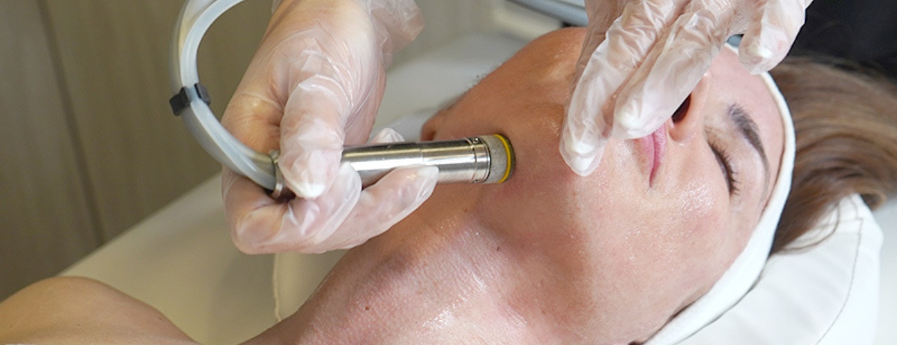 Hydrabrasion treatment